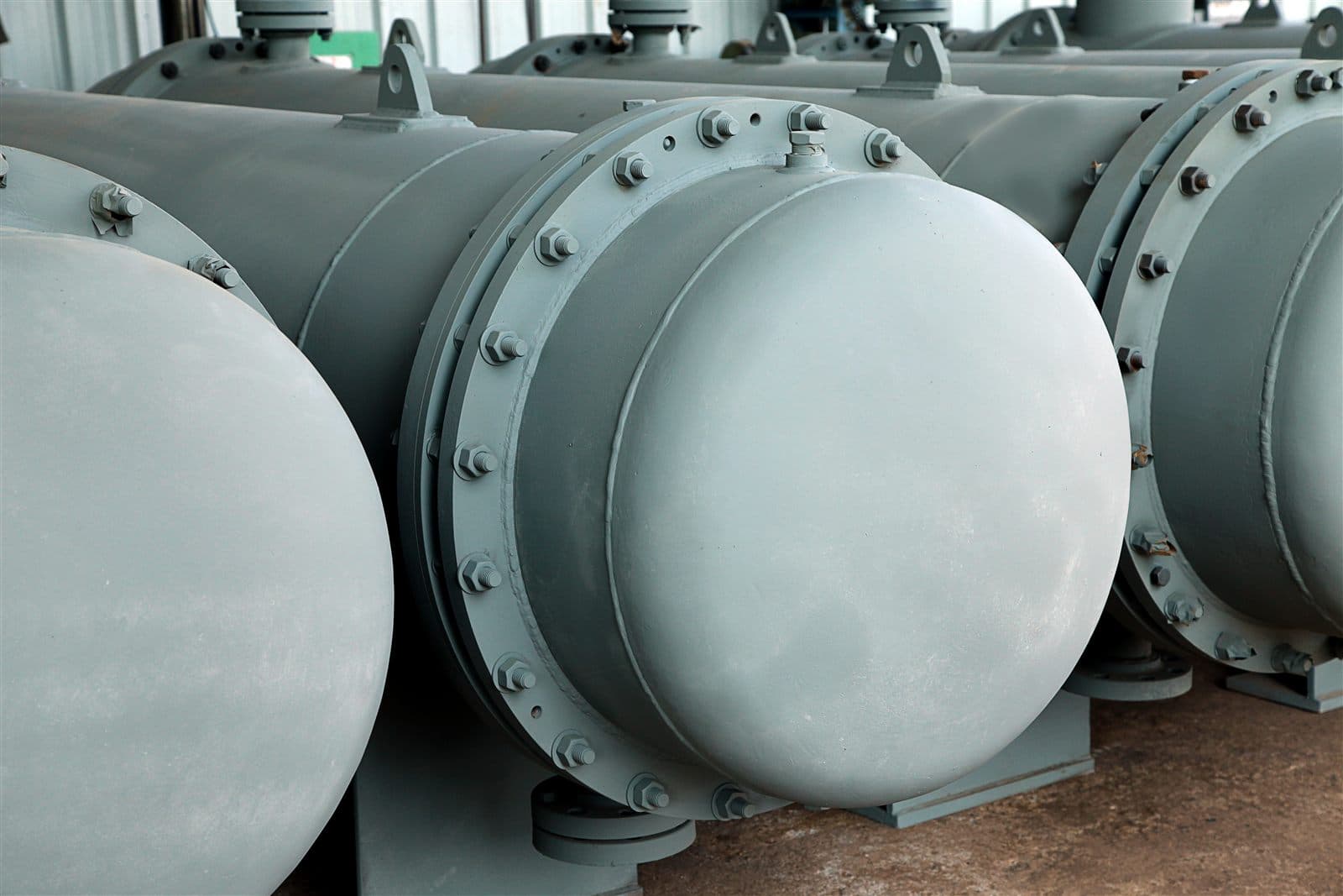 Finished shell and tube heat exchangers after coating in manufacturing bay