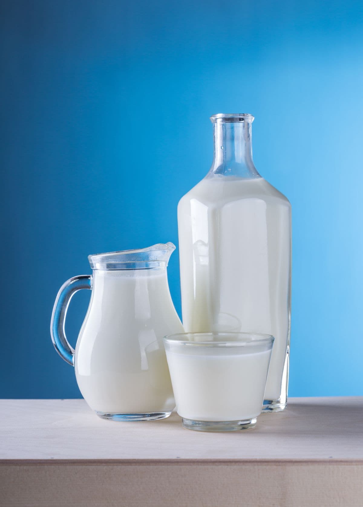 Fresh milk in glass bottles representing food and dairy processing
