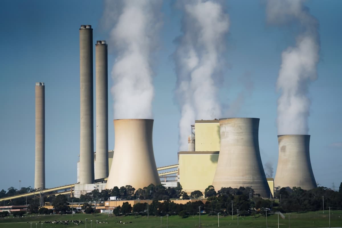 Power generation plant with cooling towers and transmission lines